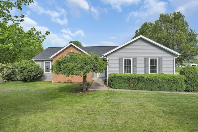 11708 Broad St, Millersport, OH 43046 - view of front of property featuring a front lawn, brick siding, and roof with shingles