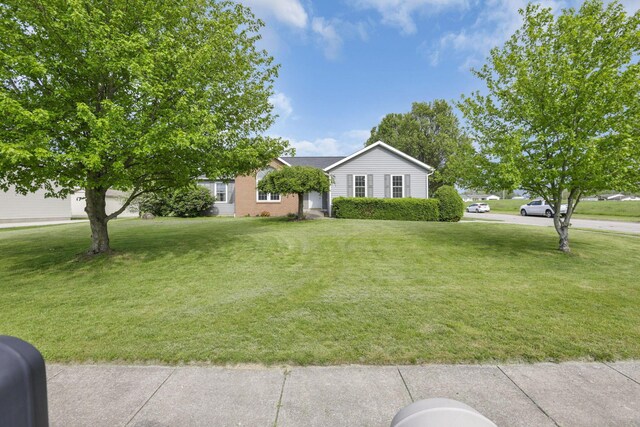 11708 Broad St, Millersport, OH 43046 - view of front of home featuring a front lawn and brick siding