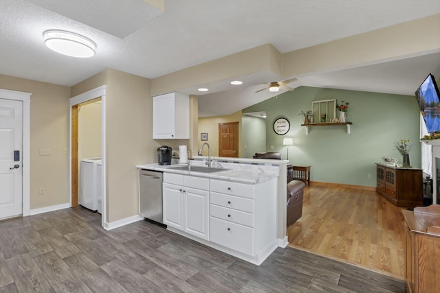 11708 Broad St, Millersport, OH 43046 - kitchen with a sink, dishwasher, washer / clothes dryer, wood finished floors, and vaulted ceiling