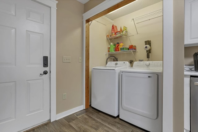11708 Broad St, Millersport, OH 43046 - laundry area with independent washer and dryer, wood finished floors, and baseboards