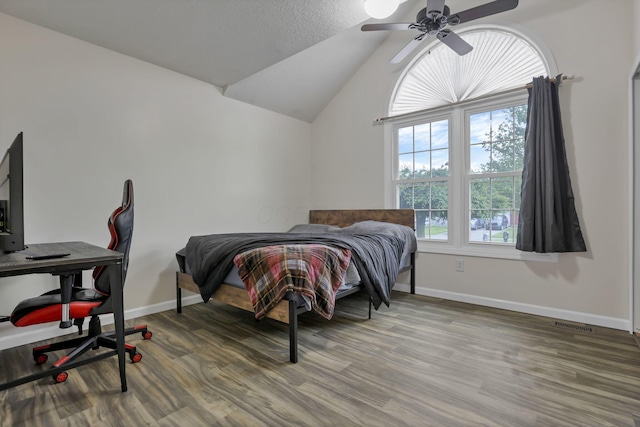 11708 Broad St, Millersport, OH 43046 - bedroom featuring wood finished floors, baseboards, vaulted ceiling, and a ceiling fan