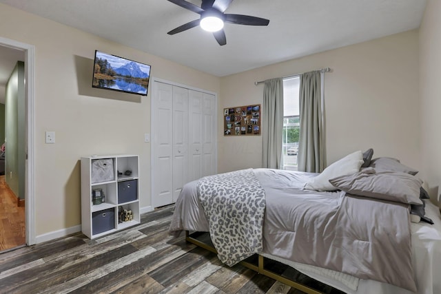 11708 Broad St, Millersport, OH 43046 - bedroom with dark wood-type flooring, a closet, baseboards, and a ceiling fan