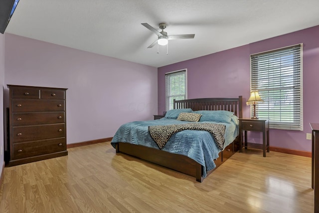 11708 Broad St, Millersport, OH 43046 - bedroom featuring light wood-style flooring, baseboards, and a ceiling fan