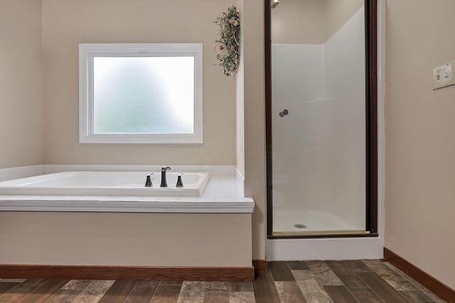 11708 Broad St, Millersport, OH 43046 - full bath featuring a shower stall, a bath, and wood finished floors