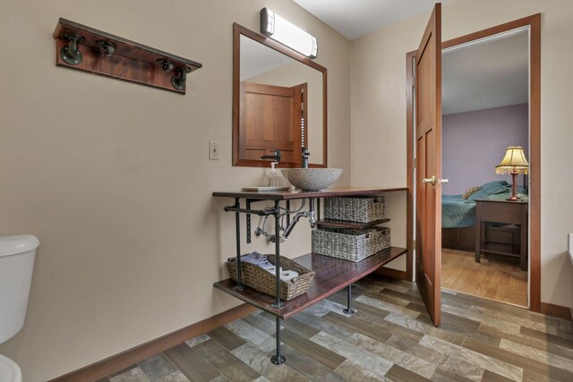 11708 Broad St, Millersport, OH 43046 - corridor featuring a wall mounted air conditioner, wood finished floors, and baseboards
