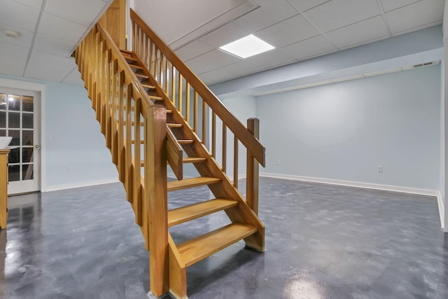 11708 Broad St, Millersport, OH 43046 - stairs featuring concrete floors, a paneled ceiling, and baseboards