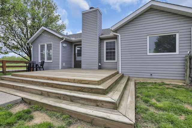 11708 Broad St, Millersport, OH 43046 - rear view of house with a chimney, a wooden deck, and fence