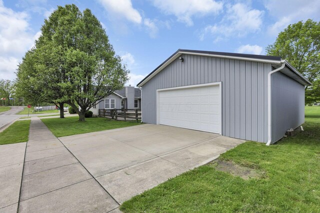 11708 Broad St, Millersport, OH 43046 - view of property exterior featuring a garage, a lawn, and an outbuilding