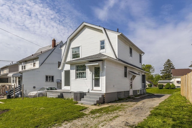 436 Nashoba Ave, Columbus, OH 43223 - back of property with a gambrel roof, central air condition unit, and a yard
