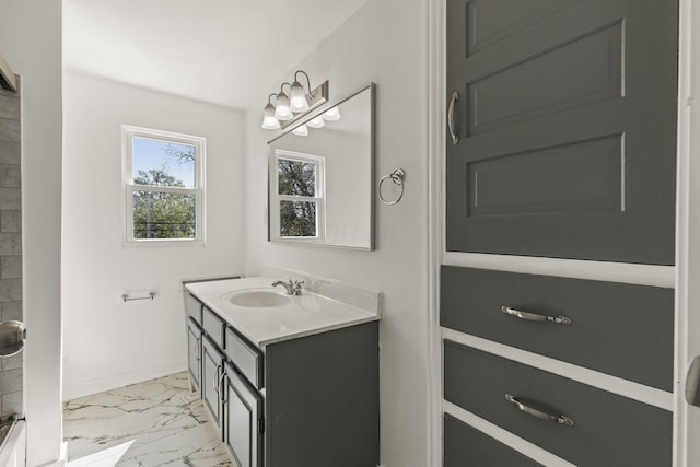 436 Nashoba Ave, Columbus, OH 43223 - full bath with marble look tile flooring, vanity, and baseboards