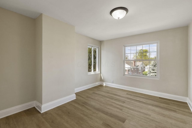 436 Nashoba Ave, Columbus, OH 43223 - empty room with wood finished floors, plenty of natural light, and baseboards