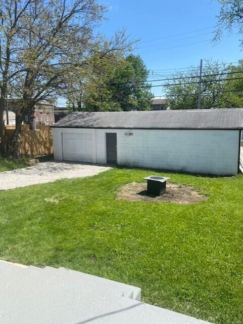 436 Nashoba Ave, Columbus, OH 43223 - view of yard featuring driveway, an outdoor structure, and a detached garage