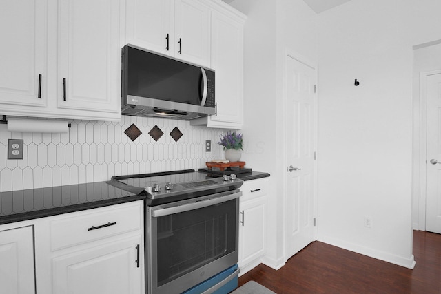 210 Carson Ct, Pickerington, OH 43147 - kitchen featuring stainless steel appliances, dark countertops, dark wood-style floors, and tasteful backsplash