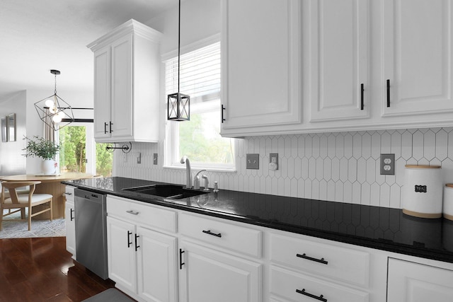 210 Carson Ct, Pickerington, OH 43147 - kitchen featuring stainless steel dishwasher, a sink, dark countertops, dark wood-style flooring, and white cabinets