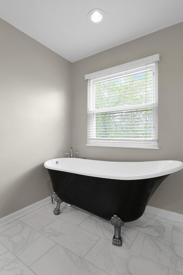 210 Carson Ct, Pickerington, OH 43147 - full bath with marble finish flooring, baseboards, and a soaking tub
