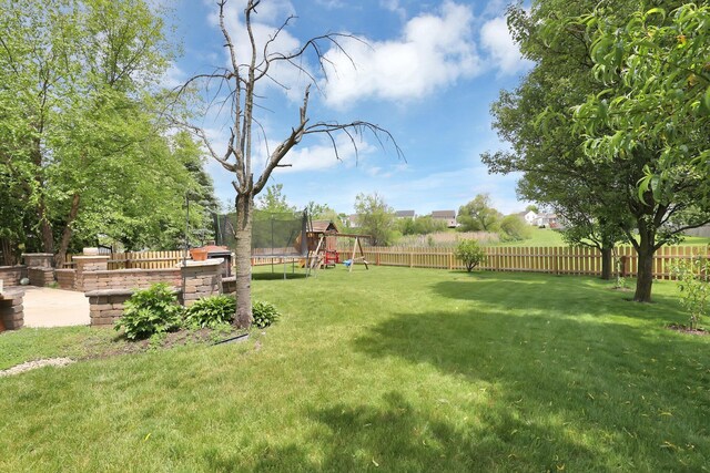 210 Carson Ct, Pickerington, OH 43147 - view of yard featuring a trampoline and a playground