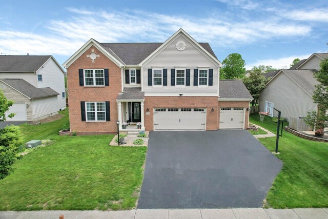 210 Carson Ct, Pickerington, OH 43147 - traditional-style home with brick siding, driveway, and a front yard