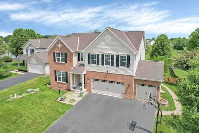 210 Carson Ct, Pickerington, OH 43147 - view of front of home featuring brick siding, driveway, an attached garage, and a shingled roof