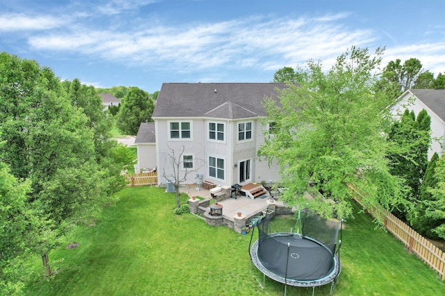 210 Carson Ct, Pickerington, OH 43147 - rear view of property featuring a trampoline, a patio, and roof with shingles