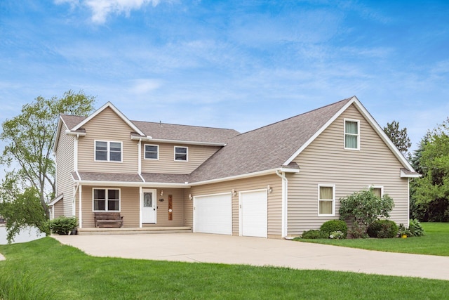 1380 E Choctaw Dr, London, OH 43140 - view of front facade with a garage, a front lawn, a shingled roof, and driveway
