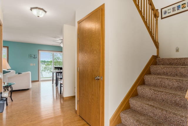 1380 E Choctaw Dr, London, OH 43140 - staircase featuring ceiling fan, wood finished floors, and baseboards