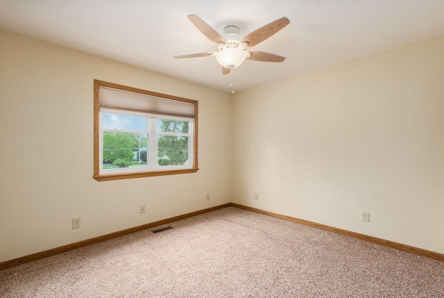 1380 E Choctaw Dr, London, OH 43140 - spare room with baseboards, light colored carpet, and ceiling fan