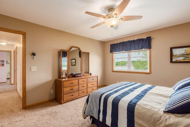 1380 E Choctaw Dr, London, OH 43140 - bedroom featuring light colored carpet, a ceiling fan, and baseboards