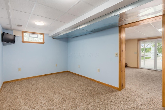 1380 E Choctaw Dr, London, OH 43140 - below grade area featuring a paneled ceiling, carpet floors, and baseboards