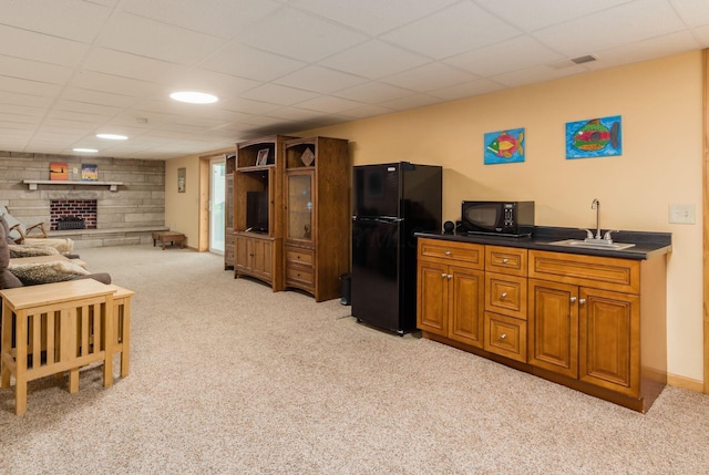 1380 E Choctaw Dr, London, OH 43140 - living area featuring light carpet, a fireplace, and a drop ceiling