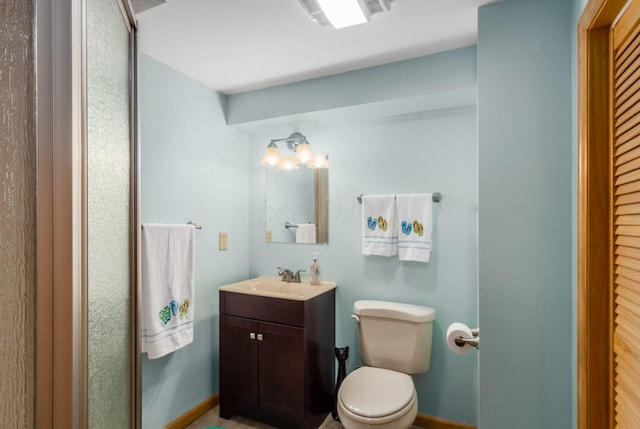 1380 E Choctaw Dr, London, OH 43140 - bathroom featuring toilet, vanity, and baseboards
