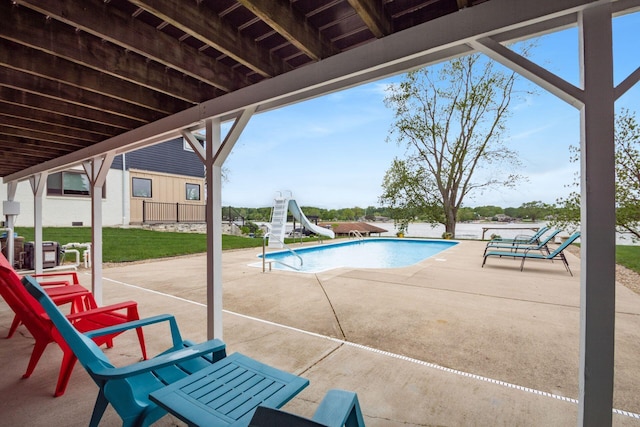 1380 E Choctaw Dr, London, OH 43140 - view of pool with a water slide, a patio area, and an empty pool