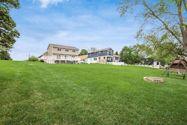 1380 E Choctaw Dr, London, OH 43140 - view of grassy yard with a fire pit