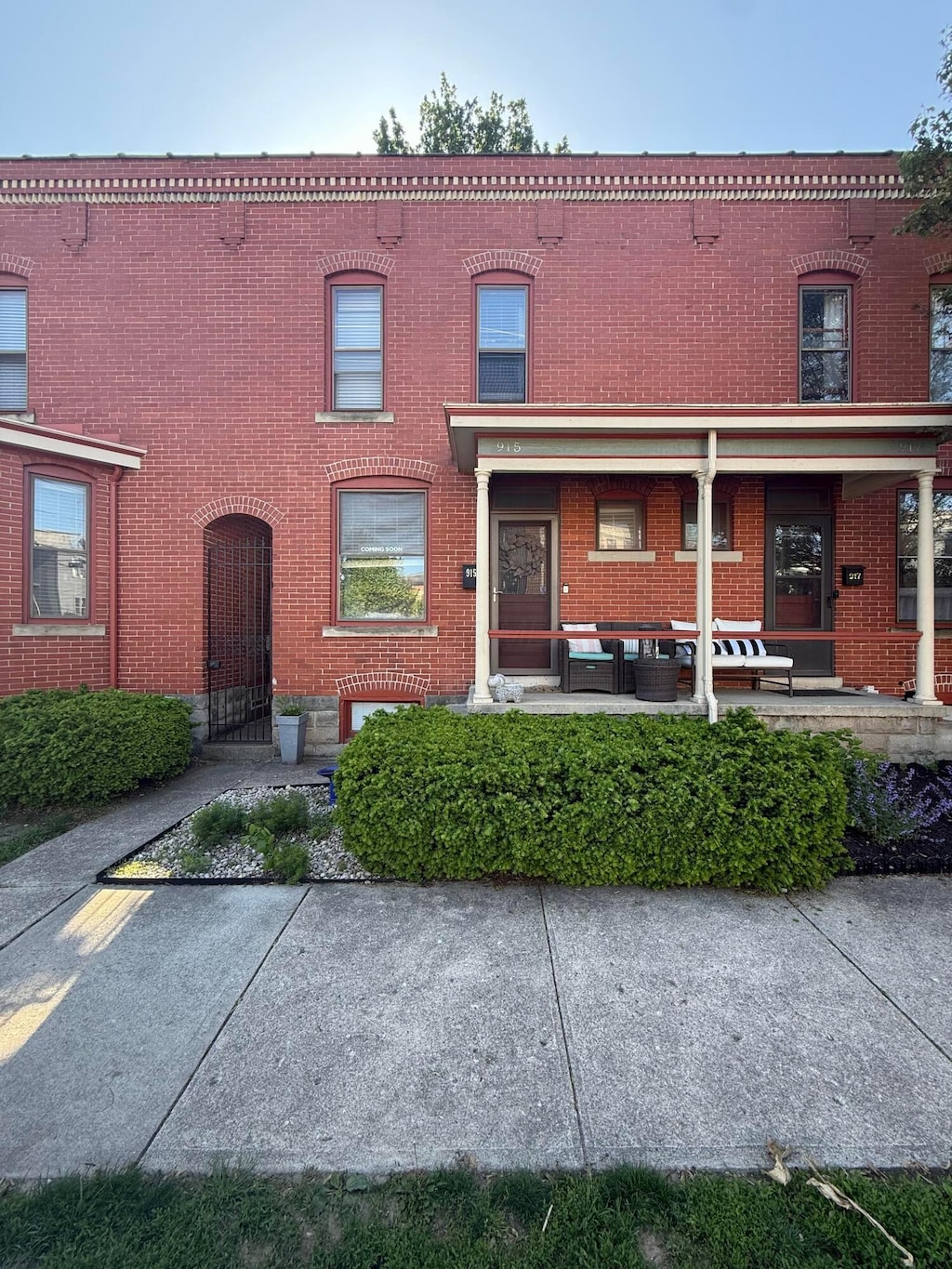 townhome / multi-family property with brick siding