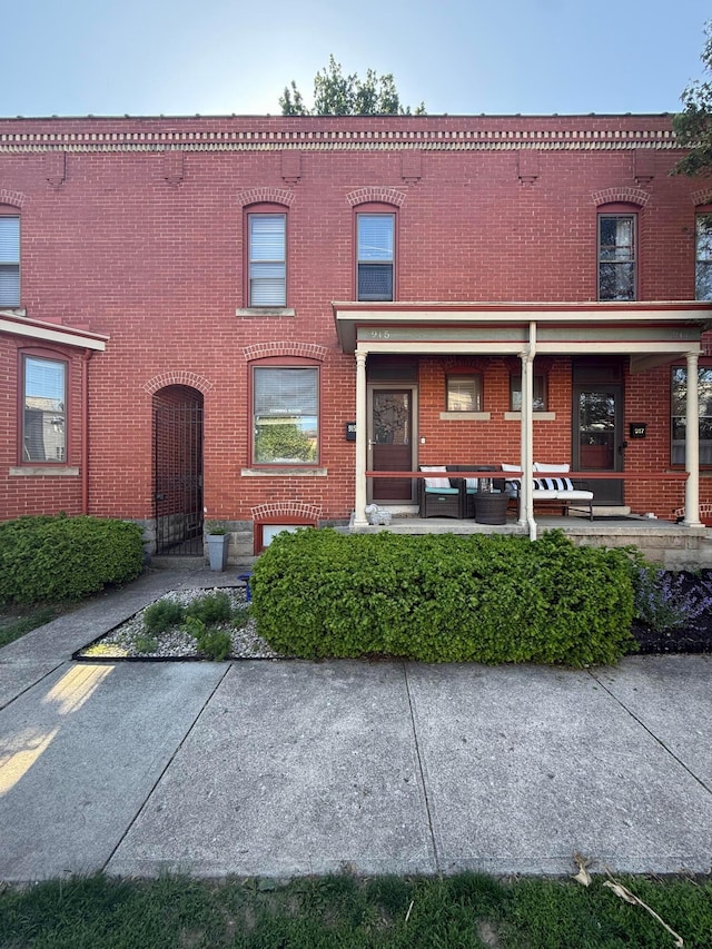 townhome / multi-family property with brick siding