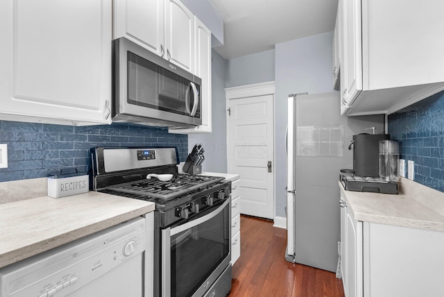 915 Dennison Ave, Columbus, OH 43201 - kitchen with stainless steel appliances, white cabinetry, and decorative backsplash