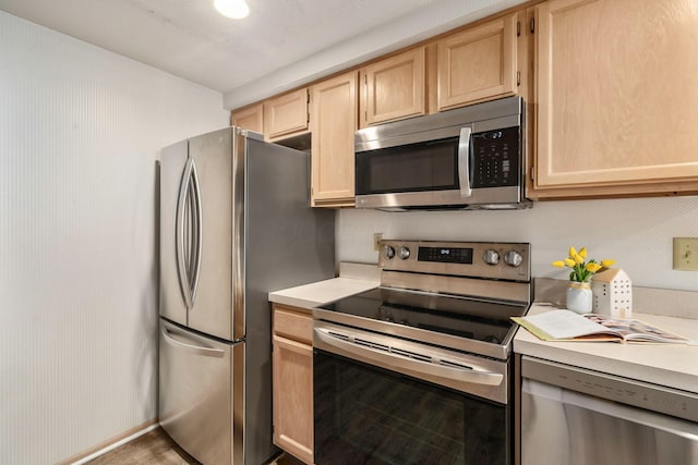 1272 Villa Oaks Ct, Columbus, OH 43230 - kitchen featuring appliances with stainless steel finishes, light brown cabinets, and light countertops