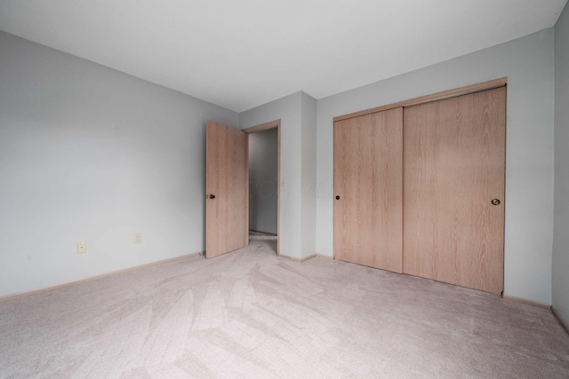 1272 Villa Oaks Ct, Columbus, OH 43230 - unfurnished bedroom featuring light colored carpet, a closet, and baseboards