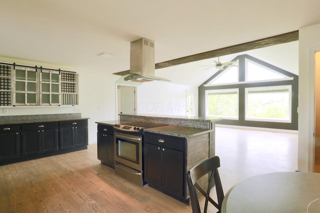 2215 Township Road 362 SE, Junction City, OH 43748 - kitchen with island exhaust hood, stainless steel range with electric stovetop, dark cabinetry, and light wood-style flooring
