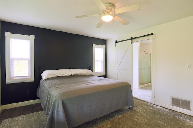 2215 Township Road 362 SE, Junction City, OH 43748 - carpeted bedroom with a barn door, baseboards, and a ceiling fan