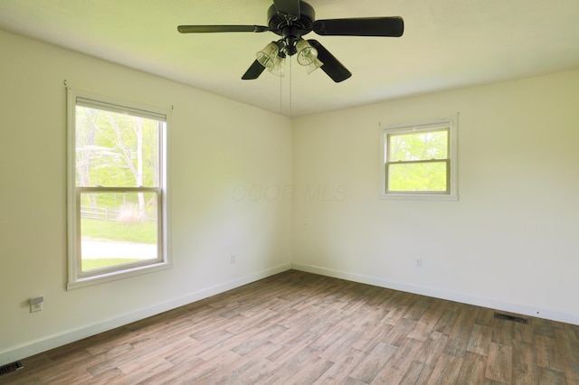 2215 Township Road 362 SE, Junction City, OH 43748 - spare room with wood finished floors, baseboards, and a ceiling fan