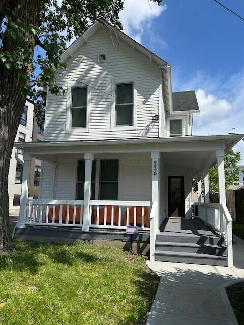 236 E 4th Ave, Columbus, OH 43201 - view of front of house featuring a porch
