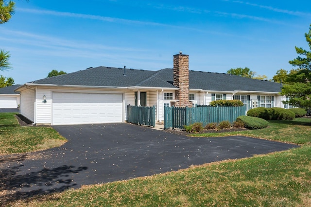 2412 Warm Springs Dr, Hilliard, OH 43026 - view of front of home with driveway, a garage, and a chimney