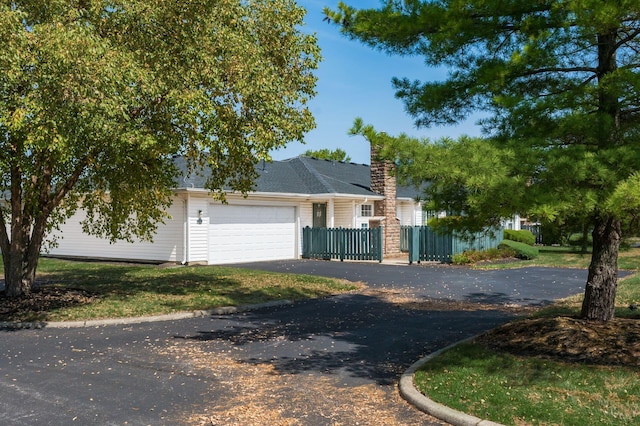 2412 Warm Springs Dr, Hilliard, OH 43026 - view of front of house featuring driveway, a garage, and a fenced front yard