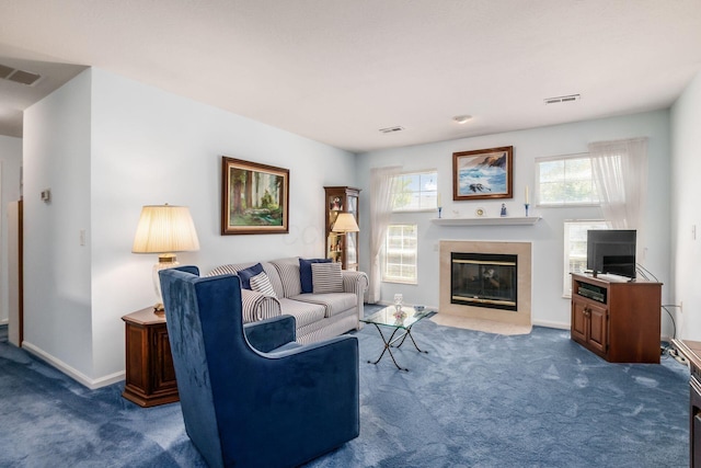 2412 Warm Springs Dr, Hilliard, OH 43026 - living room featuring dark carpet, a tiled fireplace, and baseboards