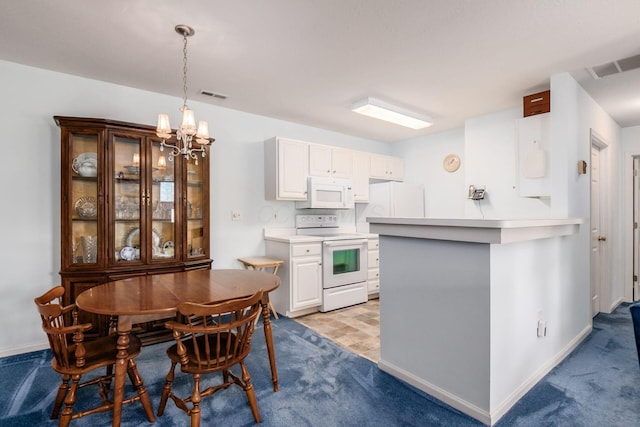 2412 Warm Springs Dr, Hilliard, OH 43026 - kitchen featuring white appliances, a chandelier, light colored carpet, and pendant lighting