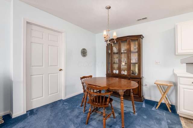 2412 Warm Springs Dr, Hilliard, OH 43026 - dining space featuring a chandelier, dark carpet, and baseboards