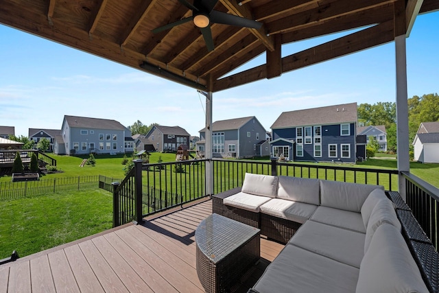 deck featuring a residential view, an outdoor living space, and ceiling fan