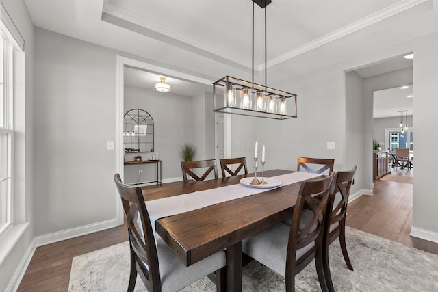 dining area featuring wood finished floors, baseboards, ornamental molding, a chandelier, and recessed lighting