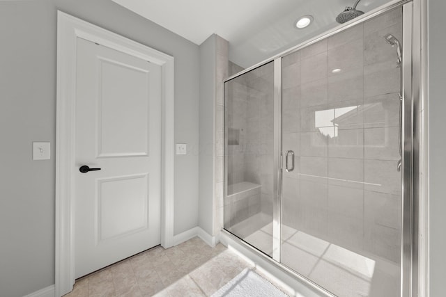 full bath featuring a shower stall, baseboards, and recessed lighting