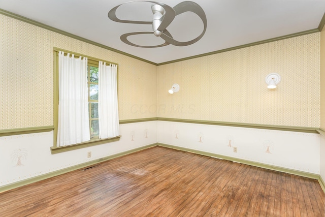 26976 Jackson Rd, Circleville, OH 43113 - unfurnished room featuring ornamental molding, hardwood / wood-style flooring, a ceiling fan, and baseboards